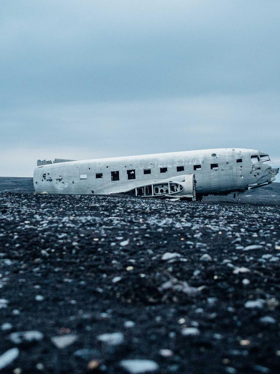 Fuselage on black sand